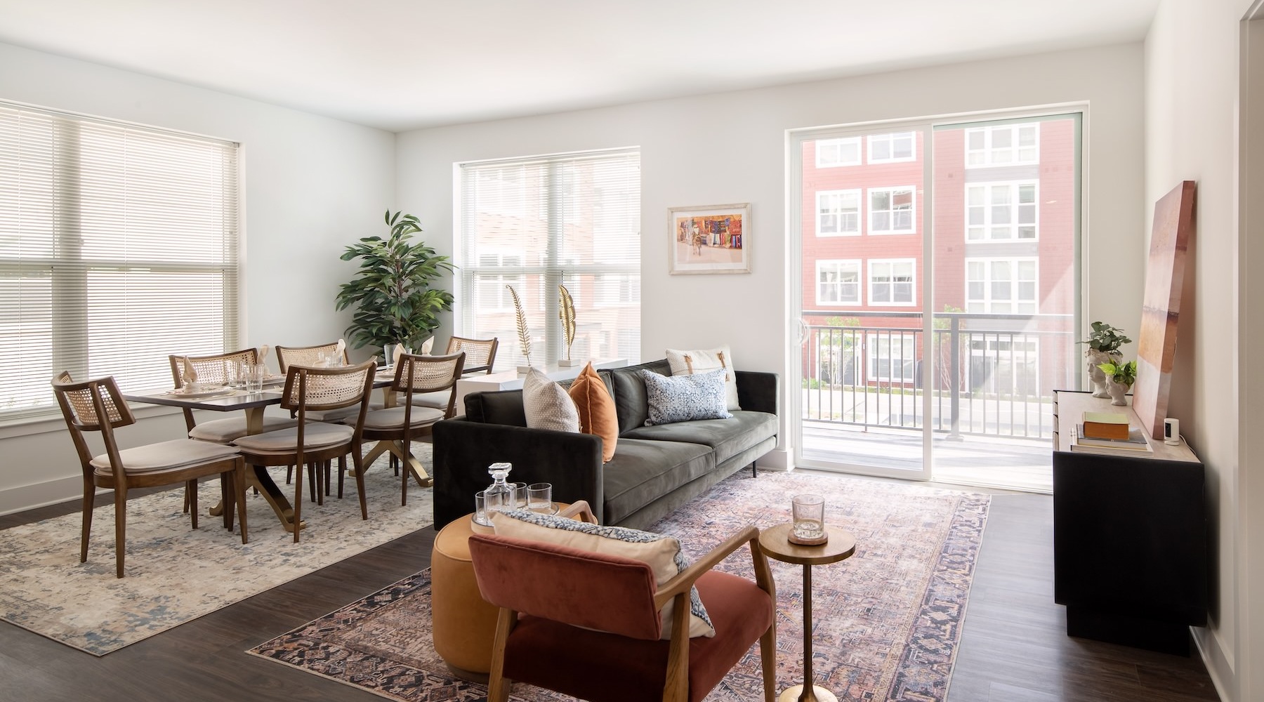 living room with seating dining room and several windows