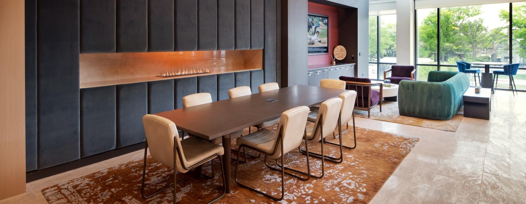 a clubroom with tables and chairs