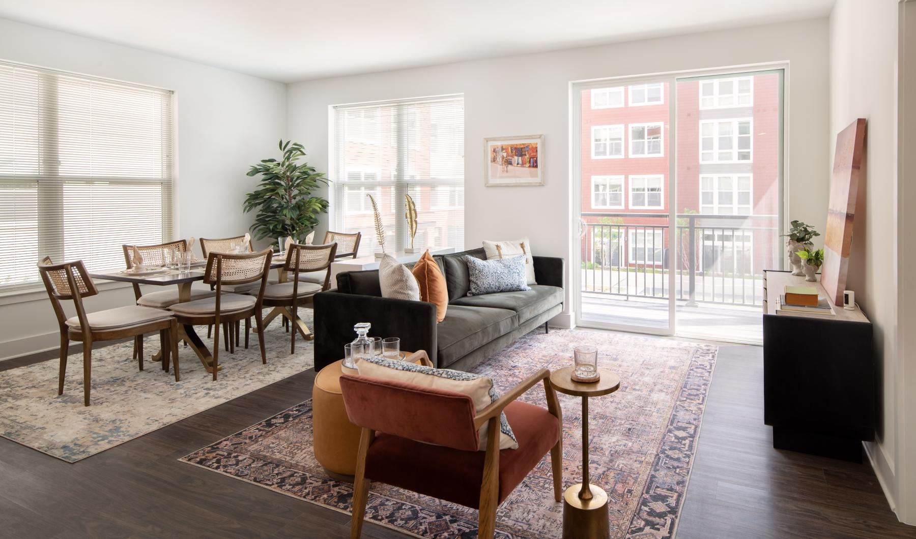 a living room with a couch and chairs