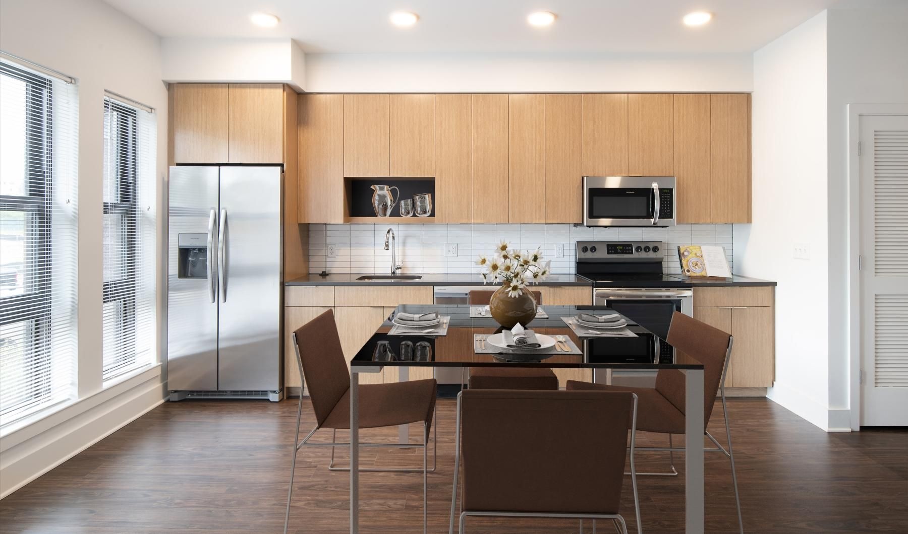 a kitchen with a dining table
