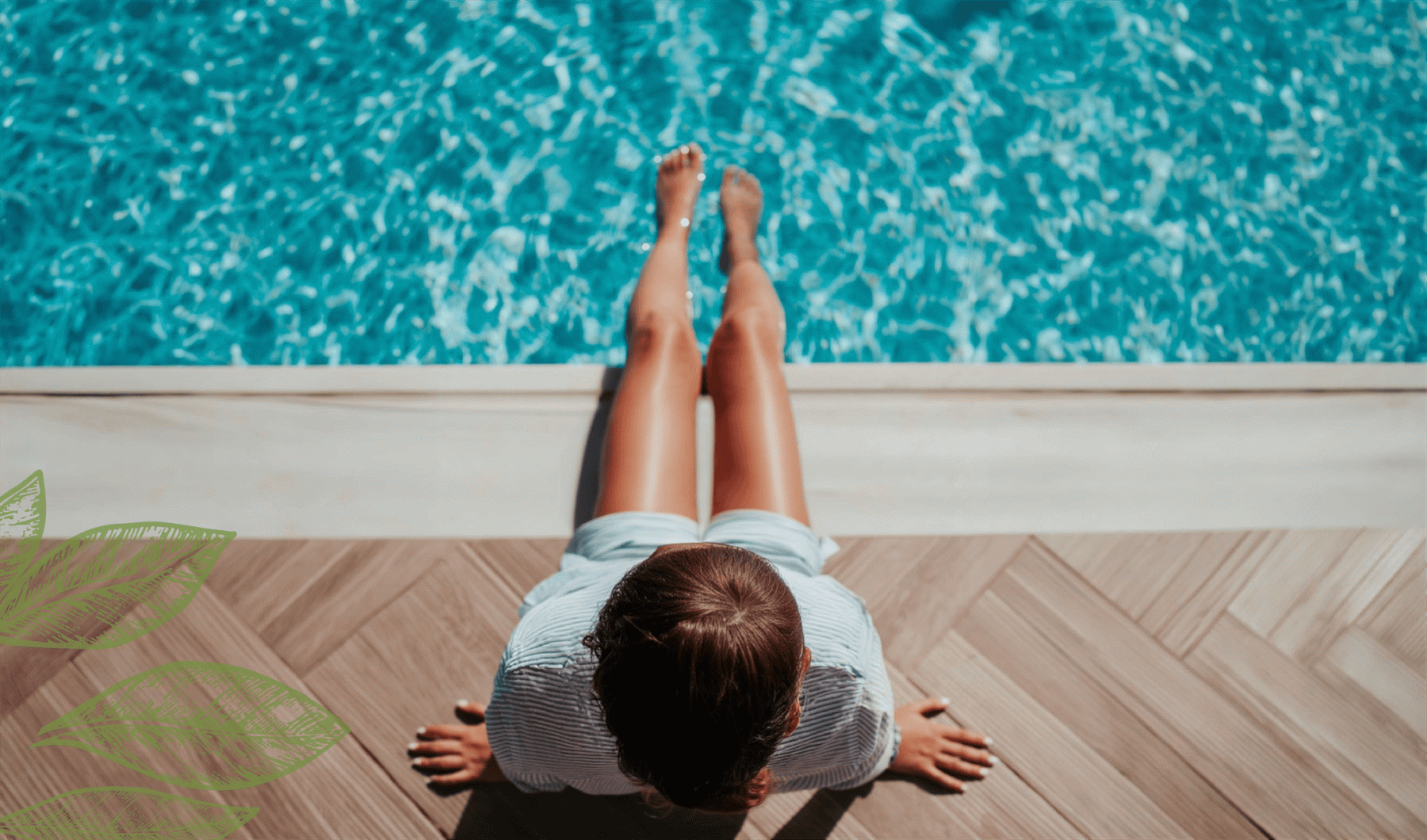 a woman sitting on the edge of a pool